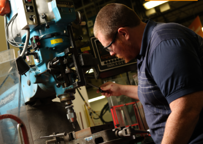 Ben works on a machine.