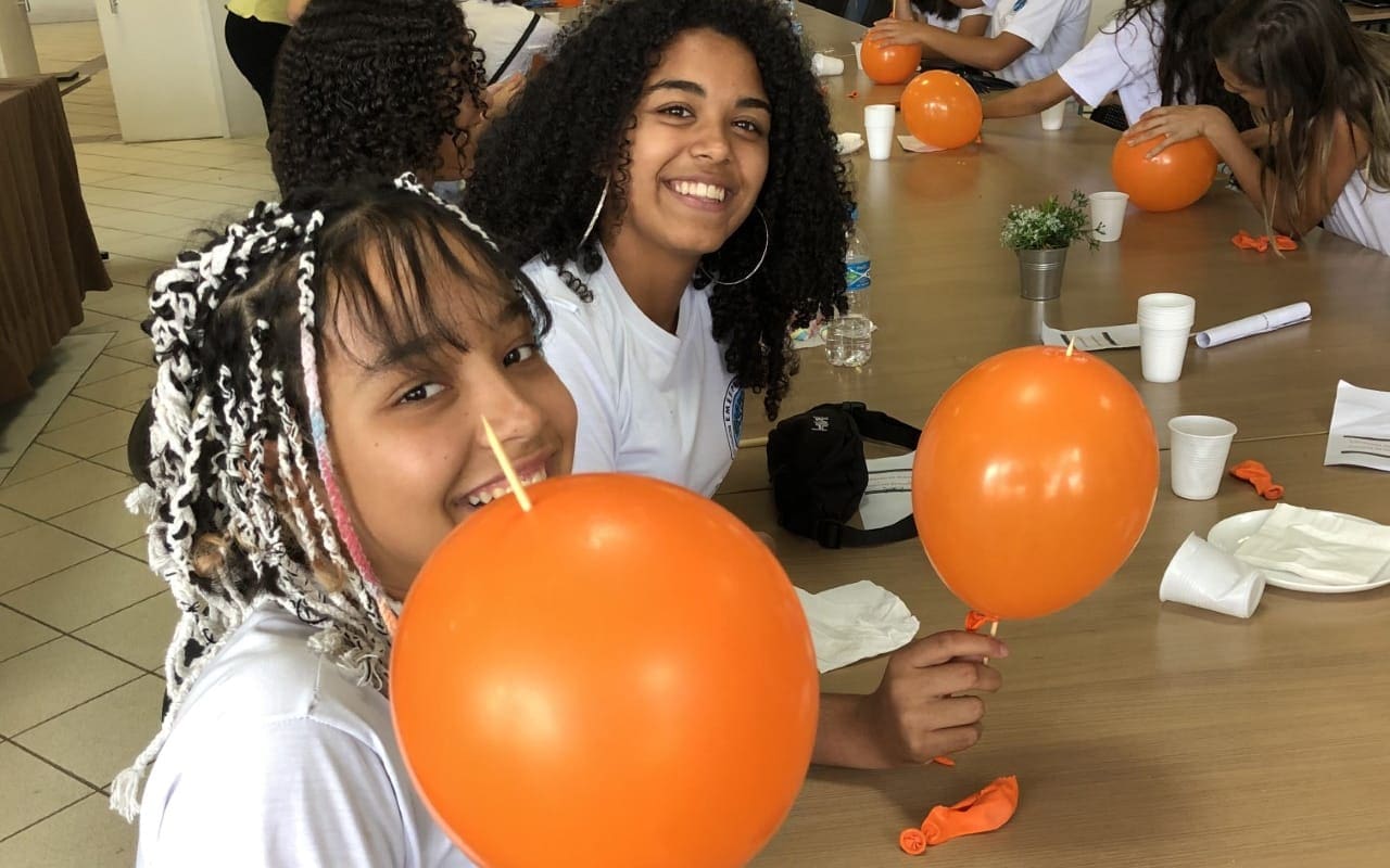 Girl_and_Mentor_with_orange_balloons-resized